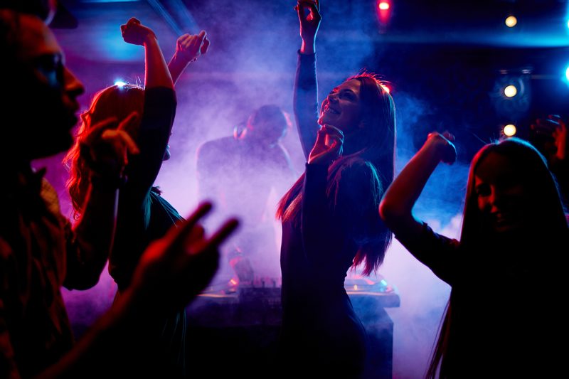 Event crowd with atmospheric lighting, illustrating event security service